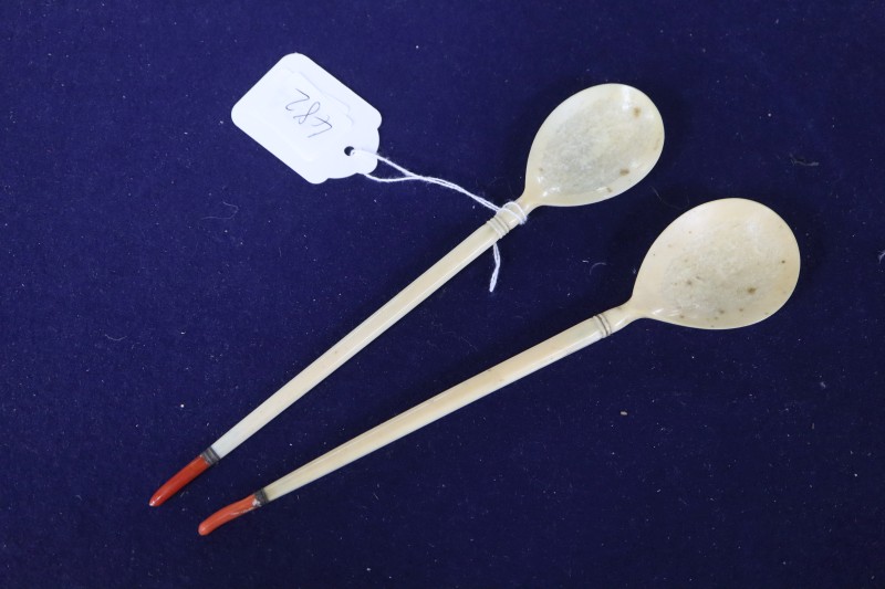 Two Ottoman walrus ivory and coral mounted sherbert spoons, Turkey, 19th century, 21.5cm